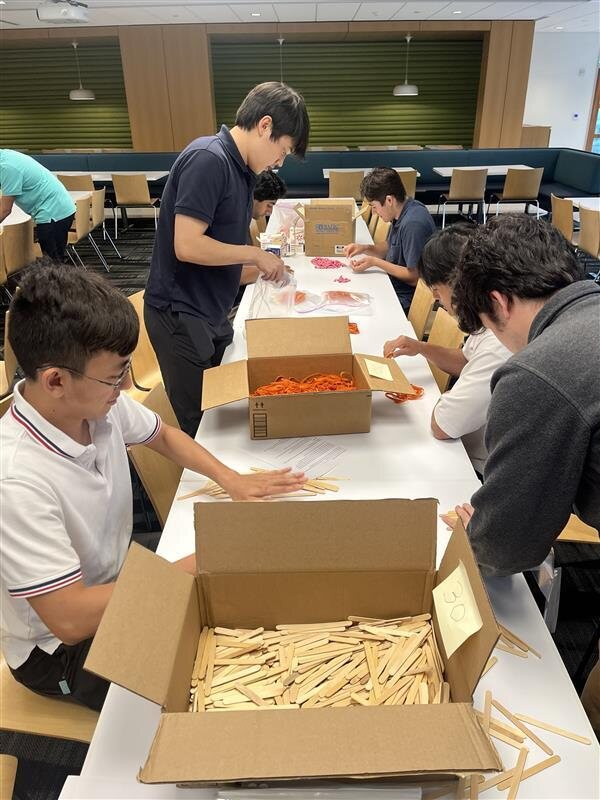 MathWorks interns pack 120+ science kits for Discovery Museum